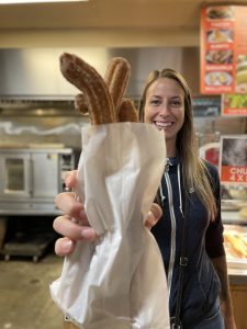 Nicole holding a bag of freshly-made churros at the St Jacobs Farmers' Market