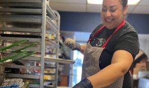 Tawnya Brant cooking in her kitchen