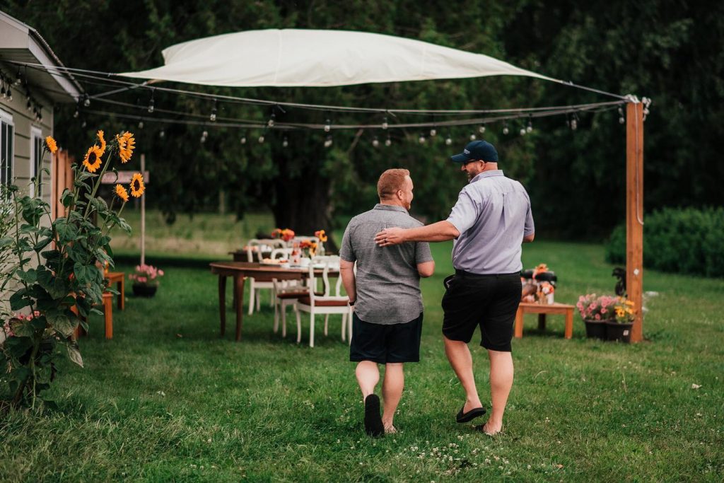couple walking towards tables at Thames River Melons