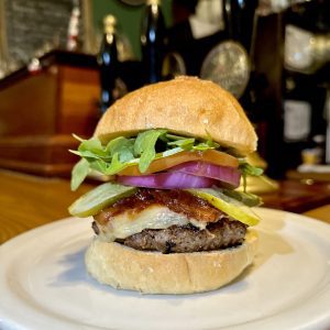 burger stacked at the wooly pub