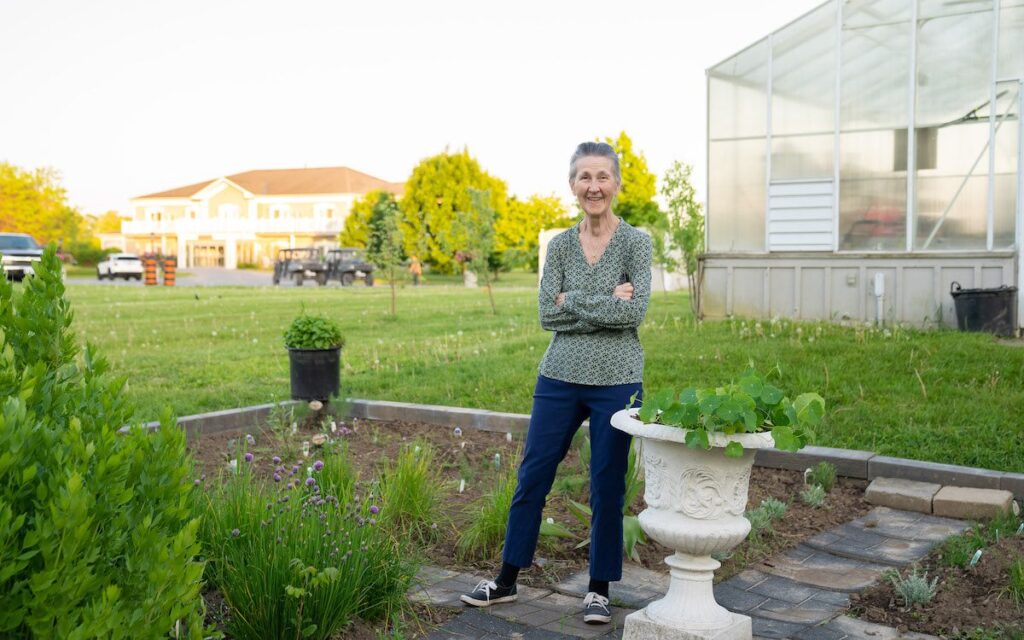 owner standing in the gardens at the waring house