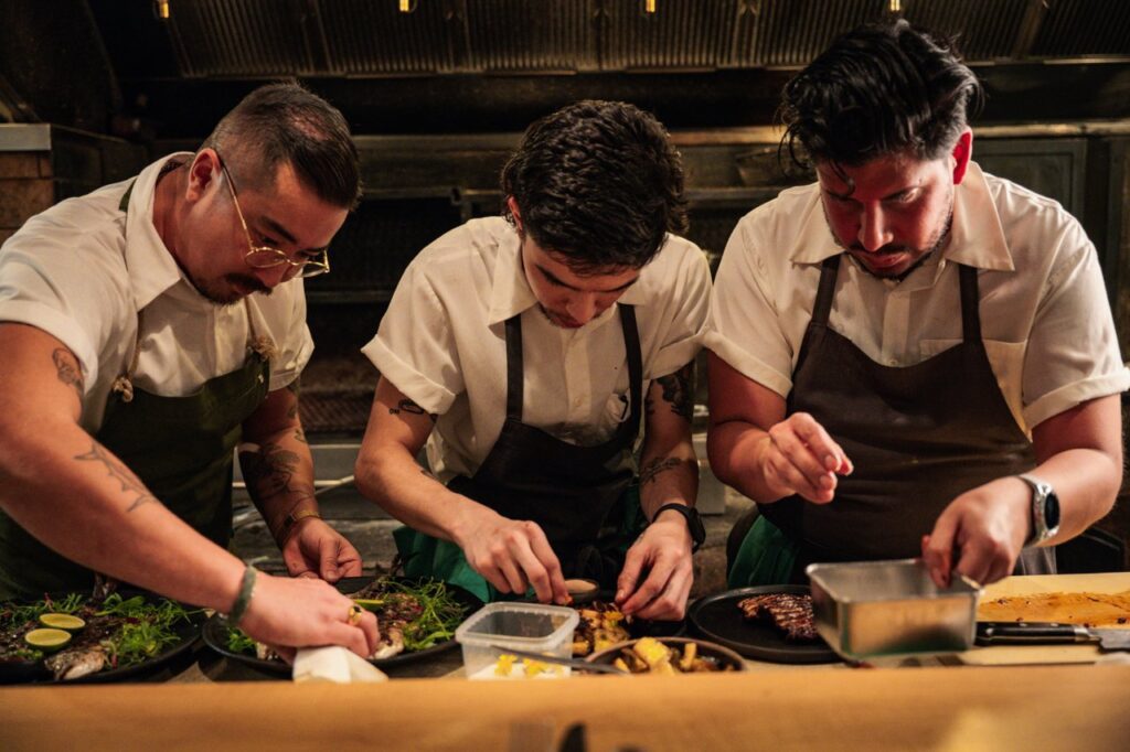 three chefs plating at Quetzal
