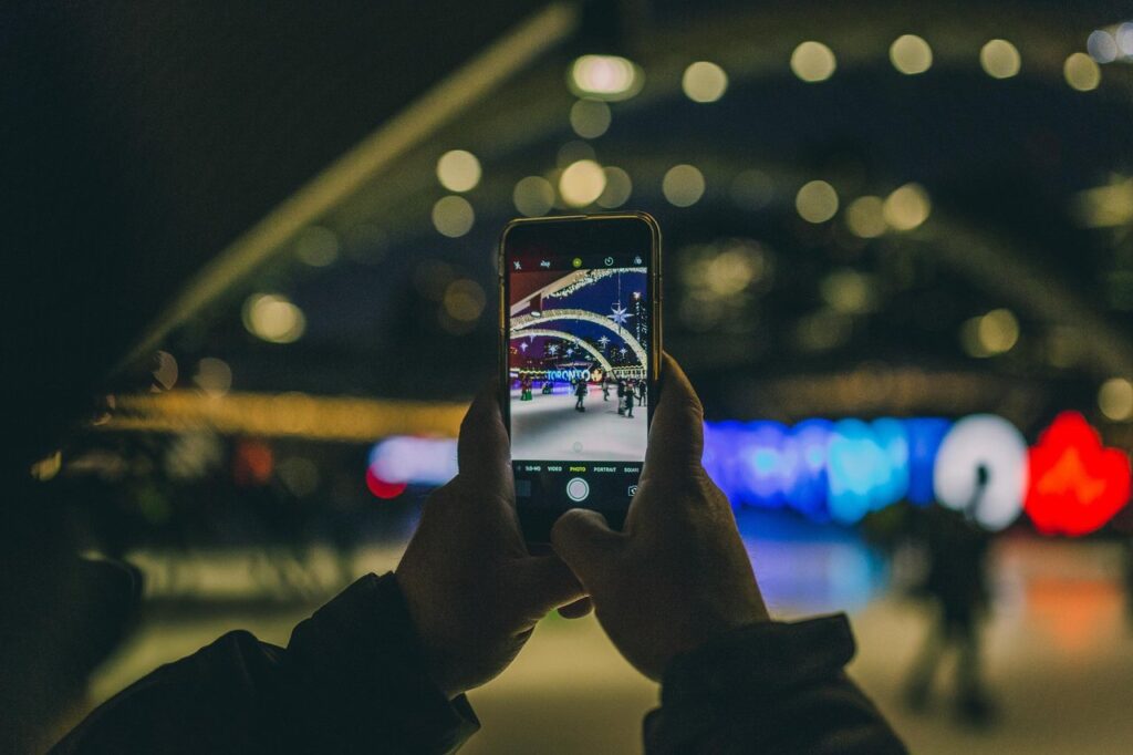 photo of somebody's phone taking a photo of nathan philipps square