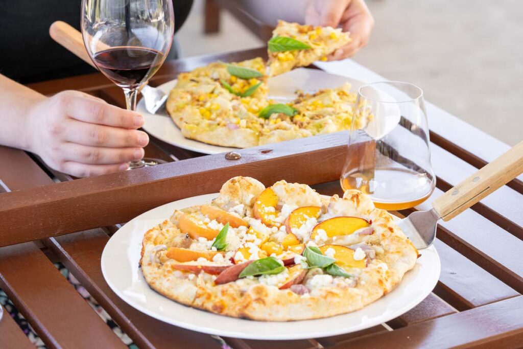 close up of pizza and wine at Southbrook