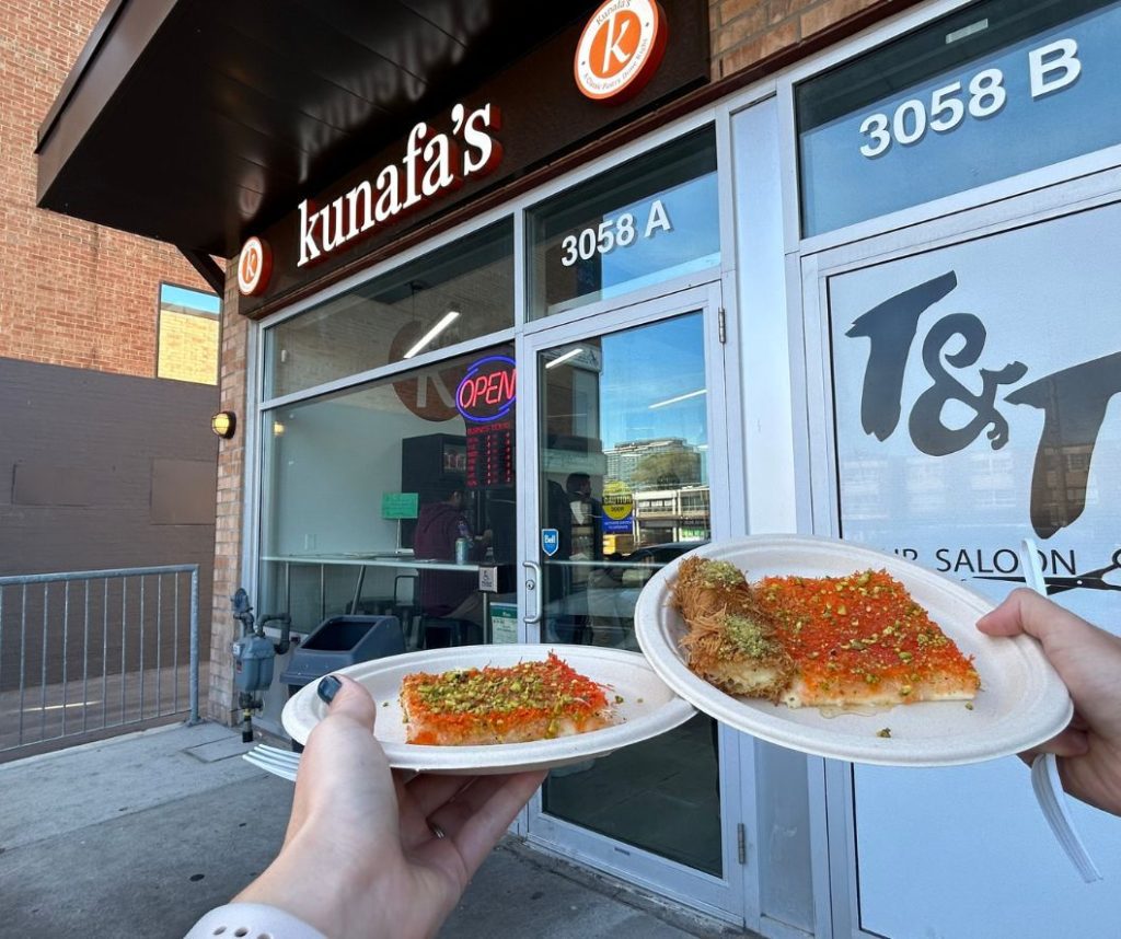 Hands holding out two kunafas and a kunafa roll