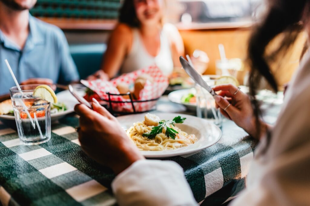 fettucini alfredo close up and friends in the background at The Barrel in simcoe