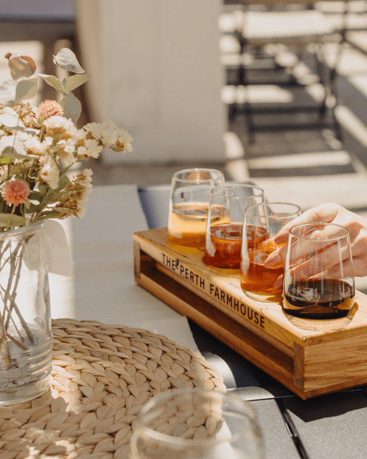 close up of a four glass wine flight on a table from Perth Farmhouse