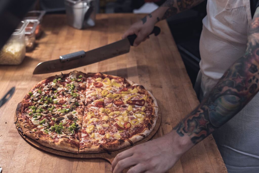 1/2 deluxe and 1/2 hawaiin pizza