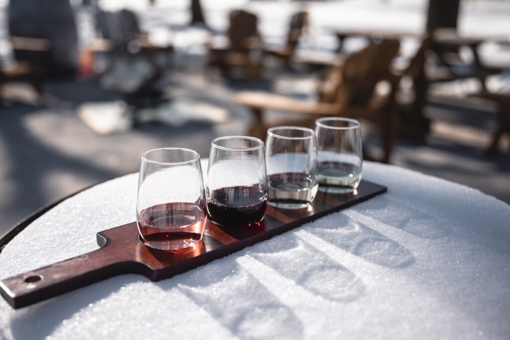 wine flight on a snowy barrel at Cooper's Hawk