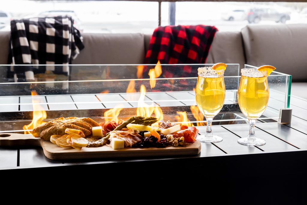 cider and cheseboard by the fire on the patio at Slabtown