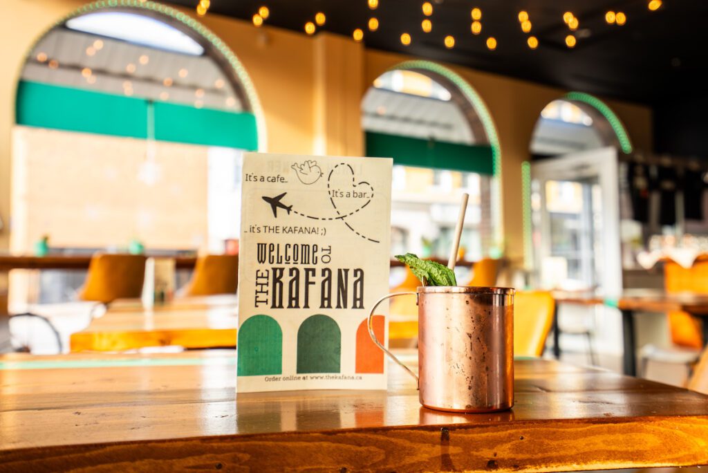 Menu on the table with a Moscow Mule at The Kafana