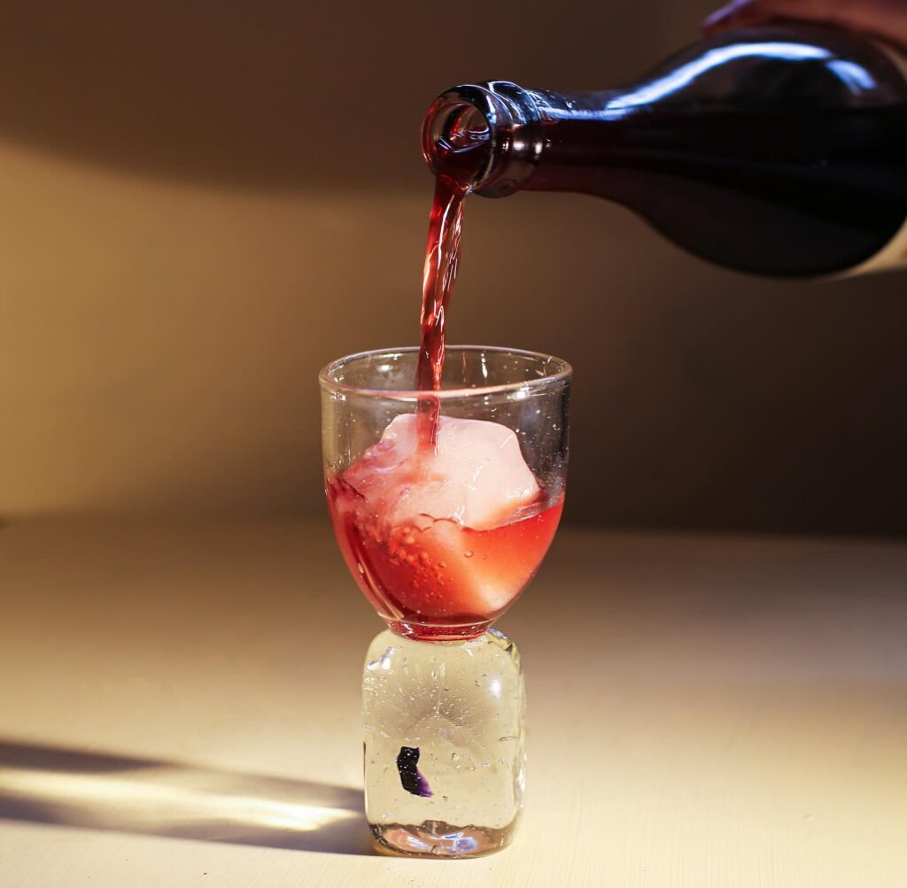 pouring cider into a cool glass