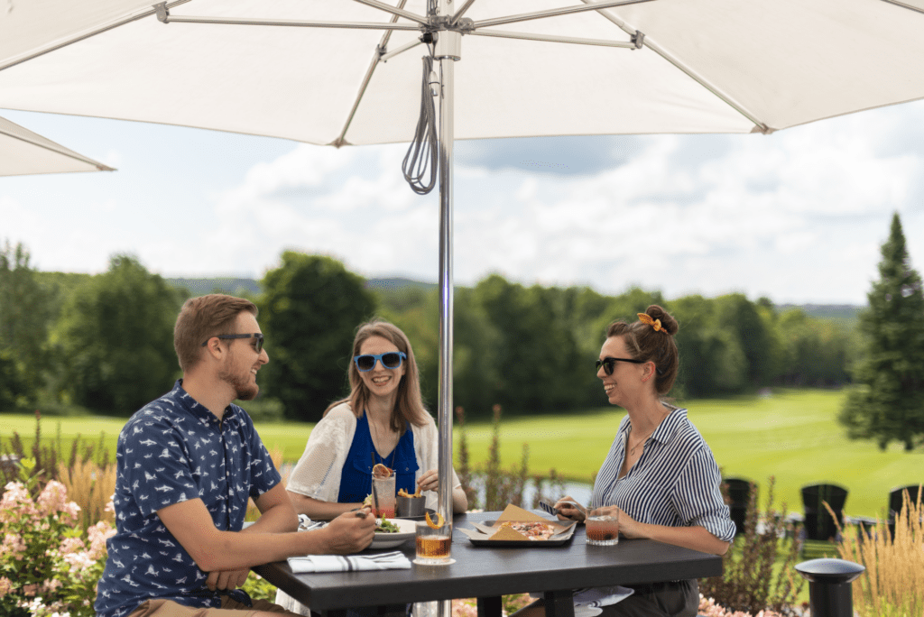 three people eating on the patio at KTCHN