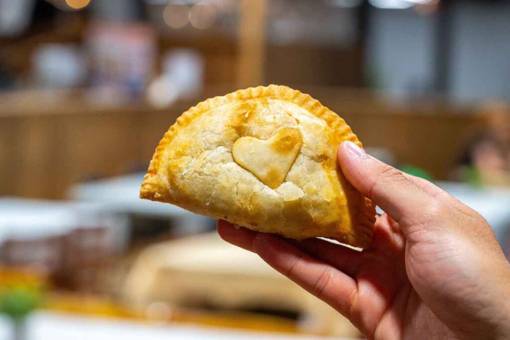 close up of a hand pie with a heart