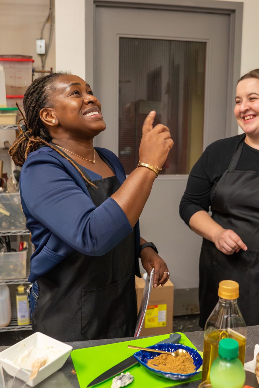 two people enjoying the cooking class at AfroGourmets