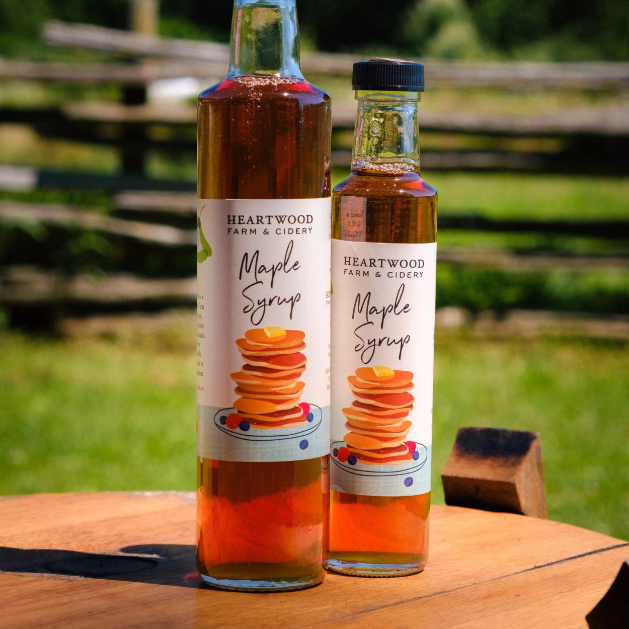 two bottles of maple syrup from Heartwood Farm and Cidery