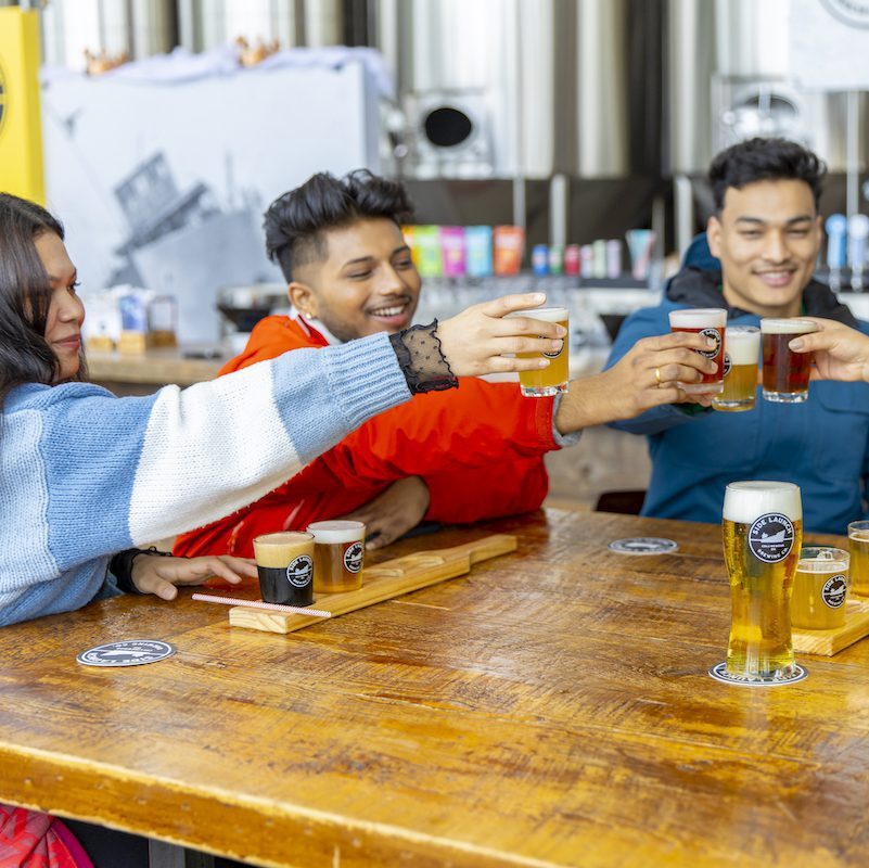 cheersing beer at Side Launch Brewery