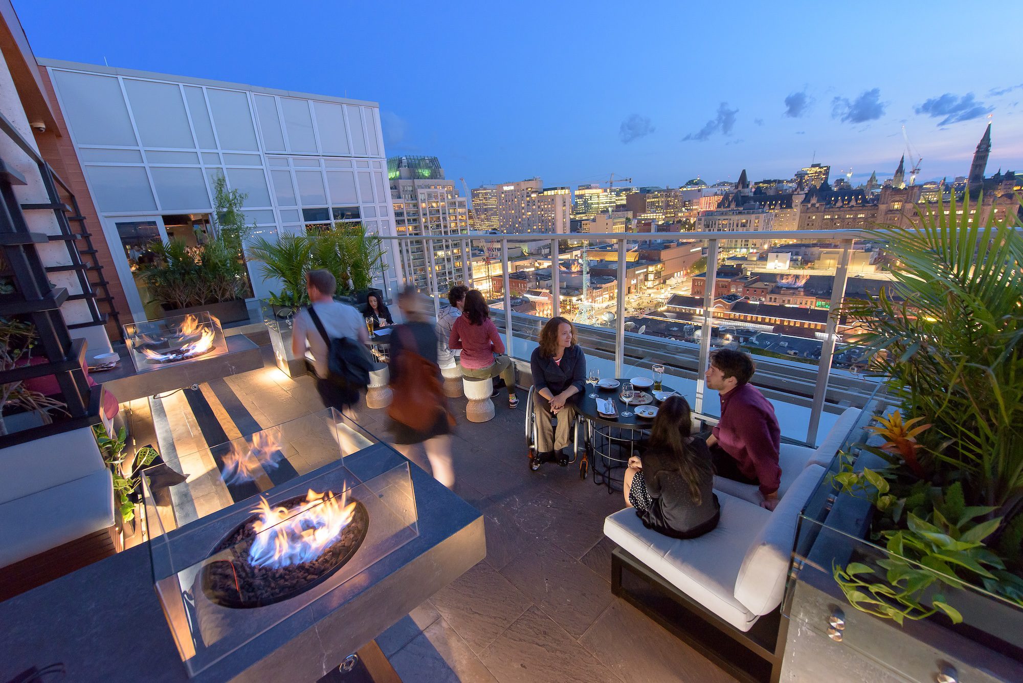 people enjoyng the rooftop patio at Andaz Copper Spirits and Sights