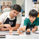 Zain and Liam building a strawberry tiramisu