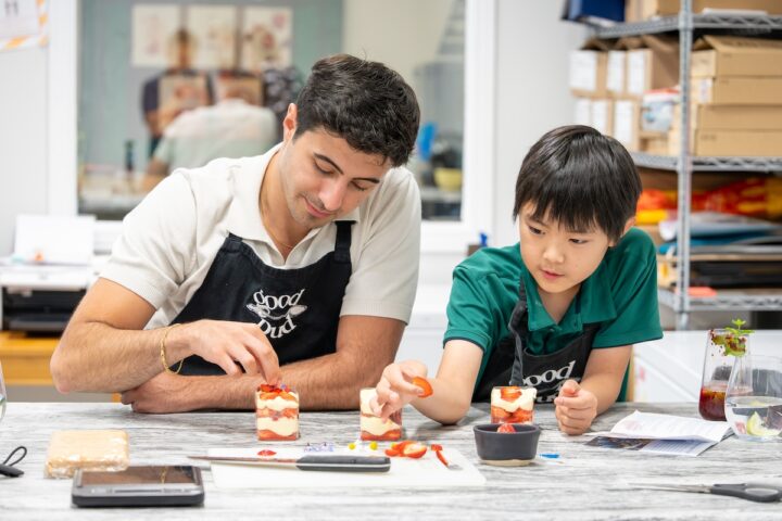 Zain and Liam building a strawberry tiramisu